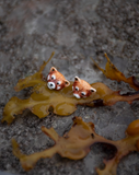 Puces d'oreilles panda roux by Nach
